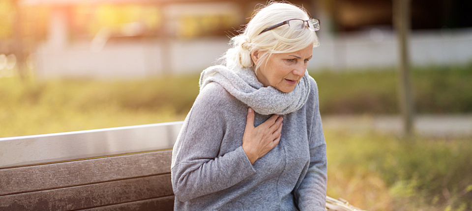 Senior Woman Suffering From Chest Pain While Sitting On Bench; Shutterstock ID 1206866299; Other: ; Purchase Order: 123; Client/Licensee: ; Job: 