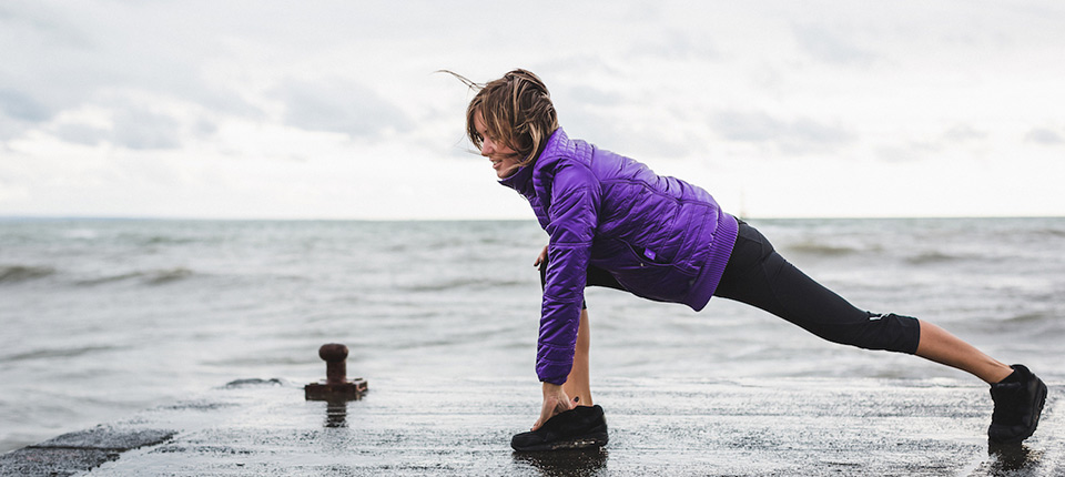 Beautiful athletic woman during workout in autumn