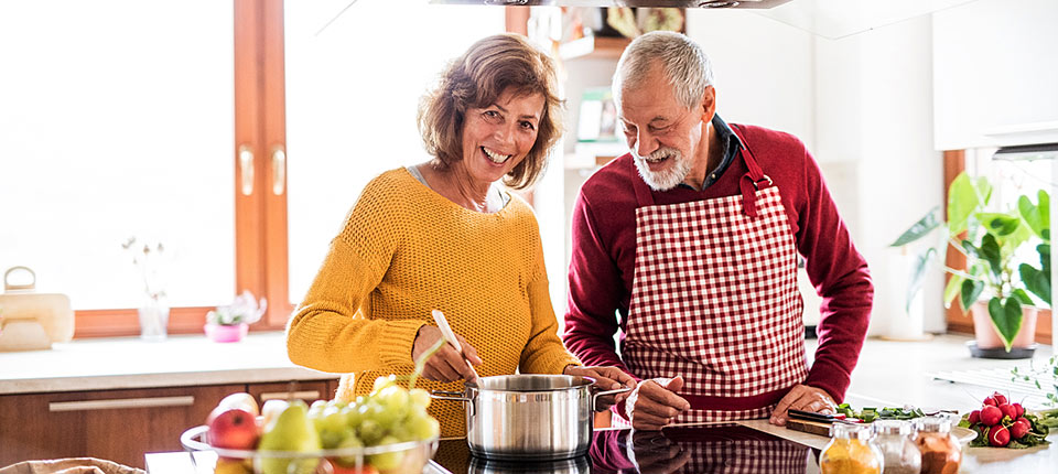 Senior couple preparing food in the kitchen.; Shutterstock ID 759510250; PO: 123